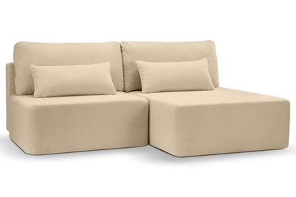 Schlafsofa mit Cordbezug in Beige, zwei Rückenkissen und breite Sitz-/Liegeflächen